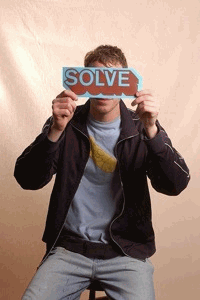 SOLVE Holding a SOLVE Sticker